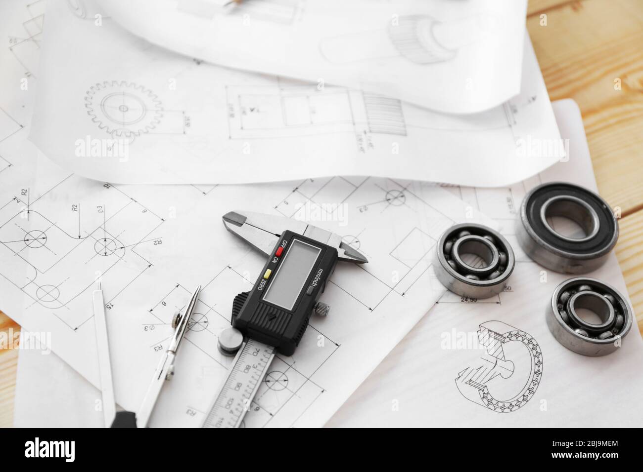Engineering drawings of parts with tools closeup Stock Photo - Alamy