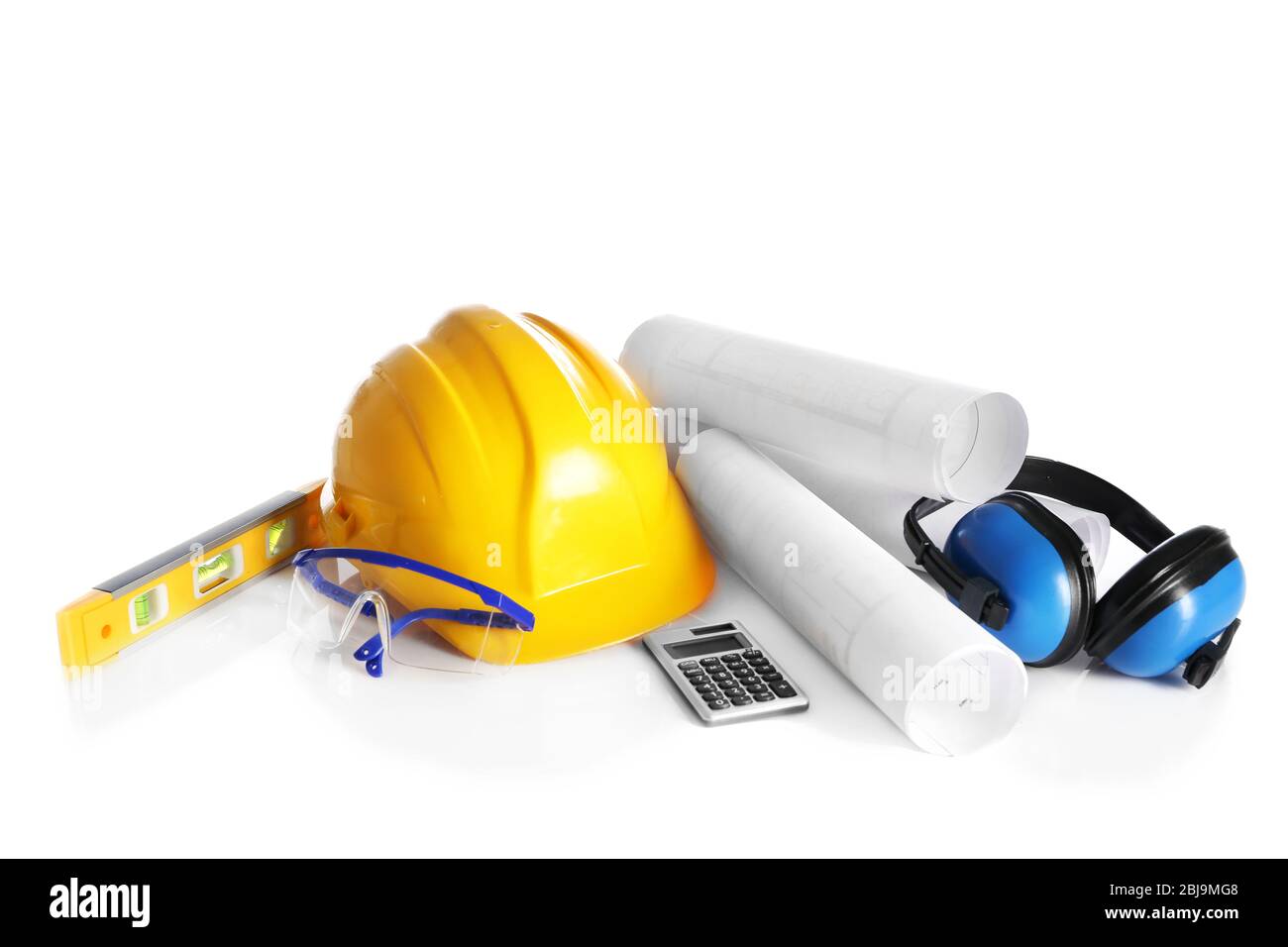 Construction drawings with tools and helmet isolated on white Stock Photo