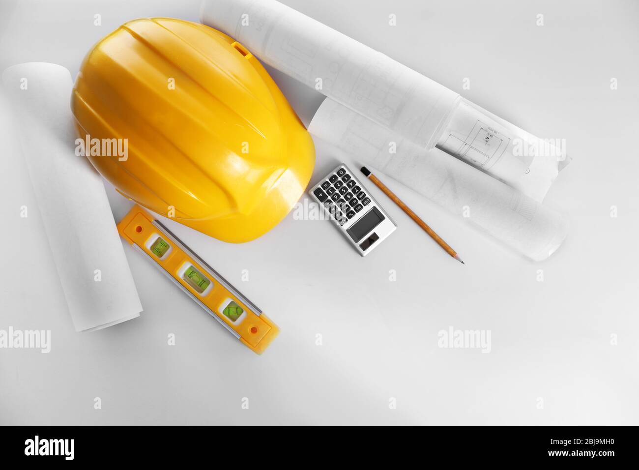 Construction drawings with tools and helmet, top view Stock Photo