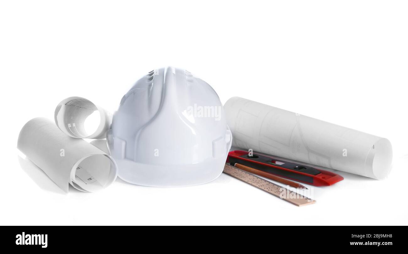 Construction drawings with tools and helmet isolated on white Stock Photo
