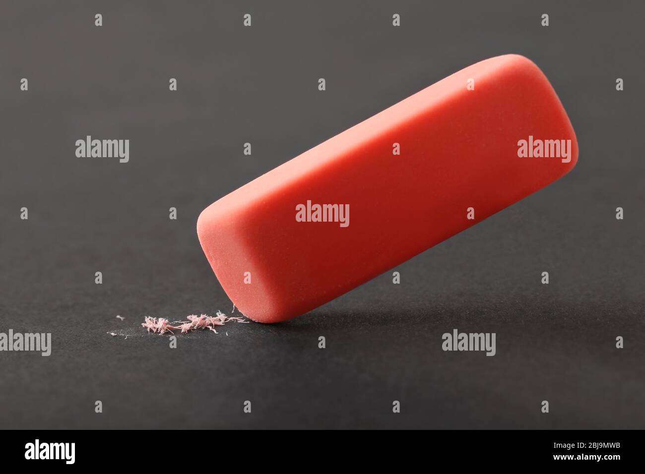 Red eraser on dark background Stock Photo Alamy