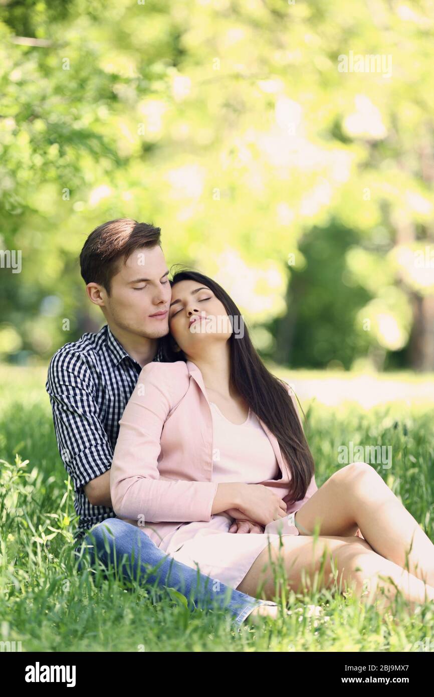 Lovely couple on grass Stock Photo - Alamy