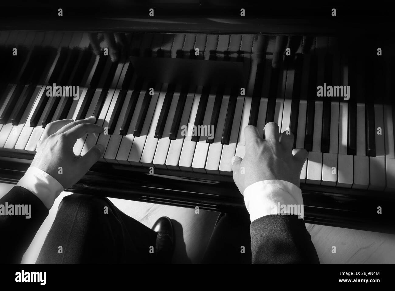 Musician playing piano Stock Photo - Alamy