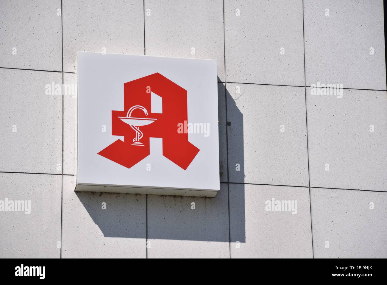 Bonn, Germany. 26th Apr, 2020. Logo, lettering of the German pharmacies with Aesculapian snake and medicine cup on one building Credit: Horst Galuschka/dpa/Alamy Live News Stock Photo