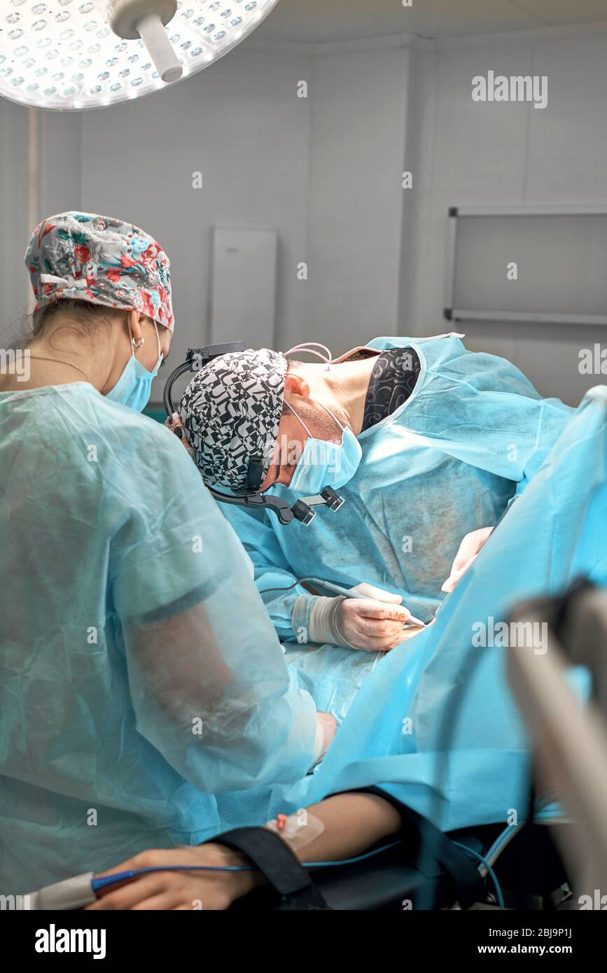 doctor performs plastic surgery Stock Photo Alamy