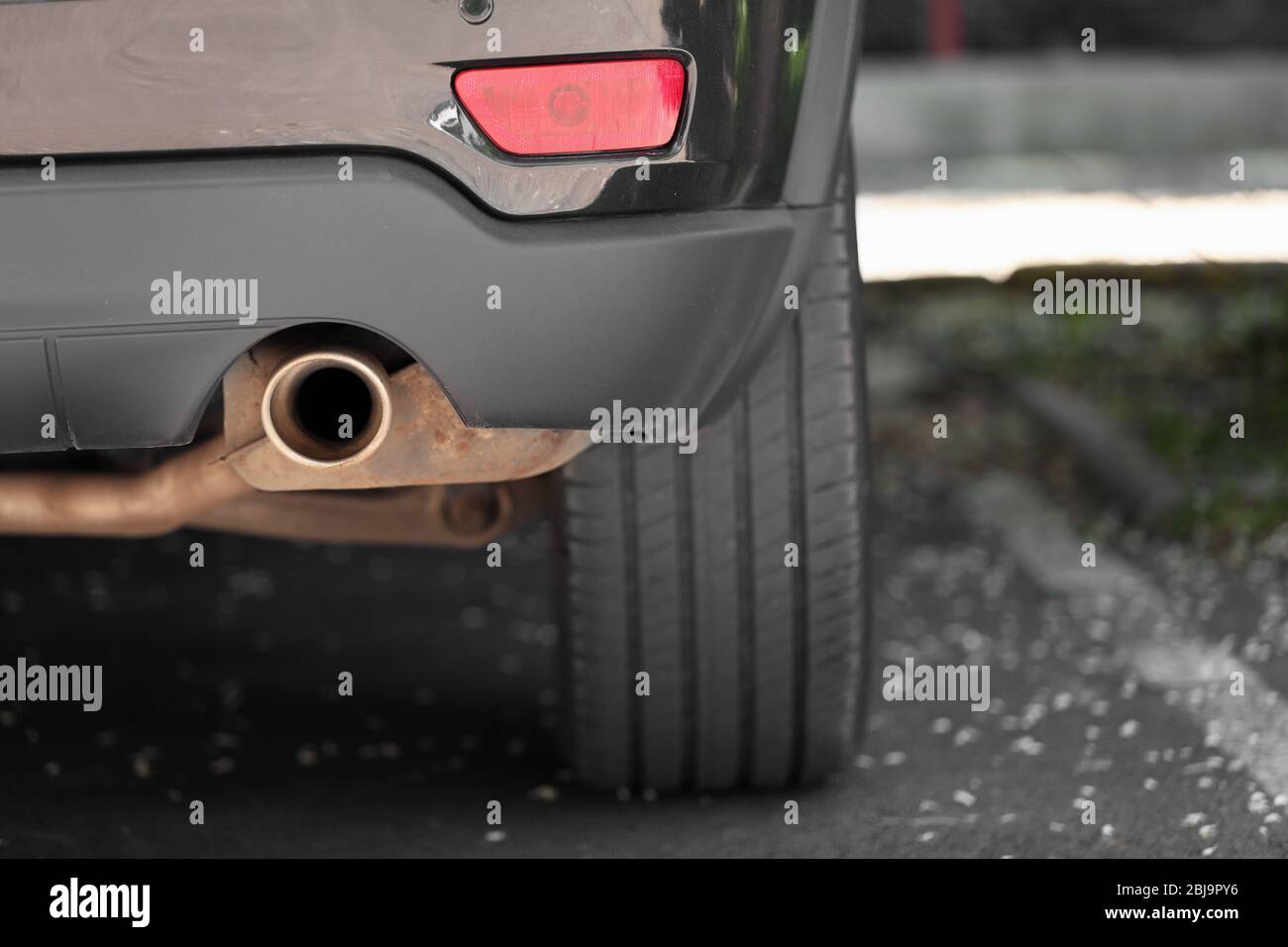 Exhaust pipe and back part of a car Stock Photo Alamy