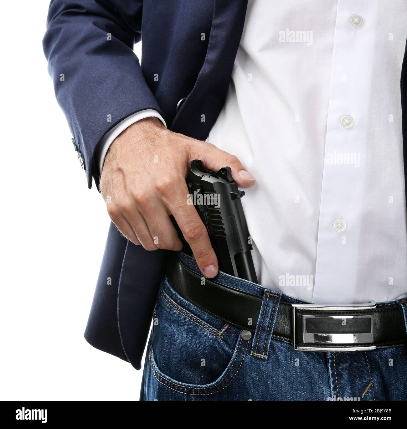 Man with gun tucked in pants isolated on white Stock Photo Alamy
