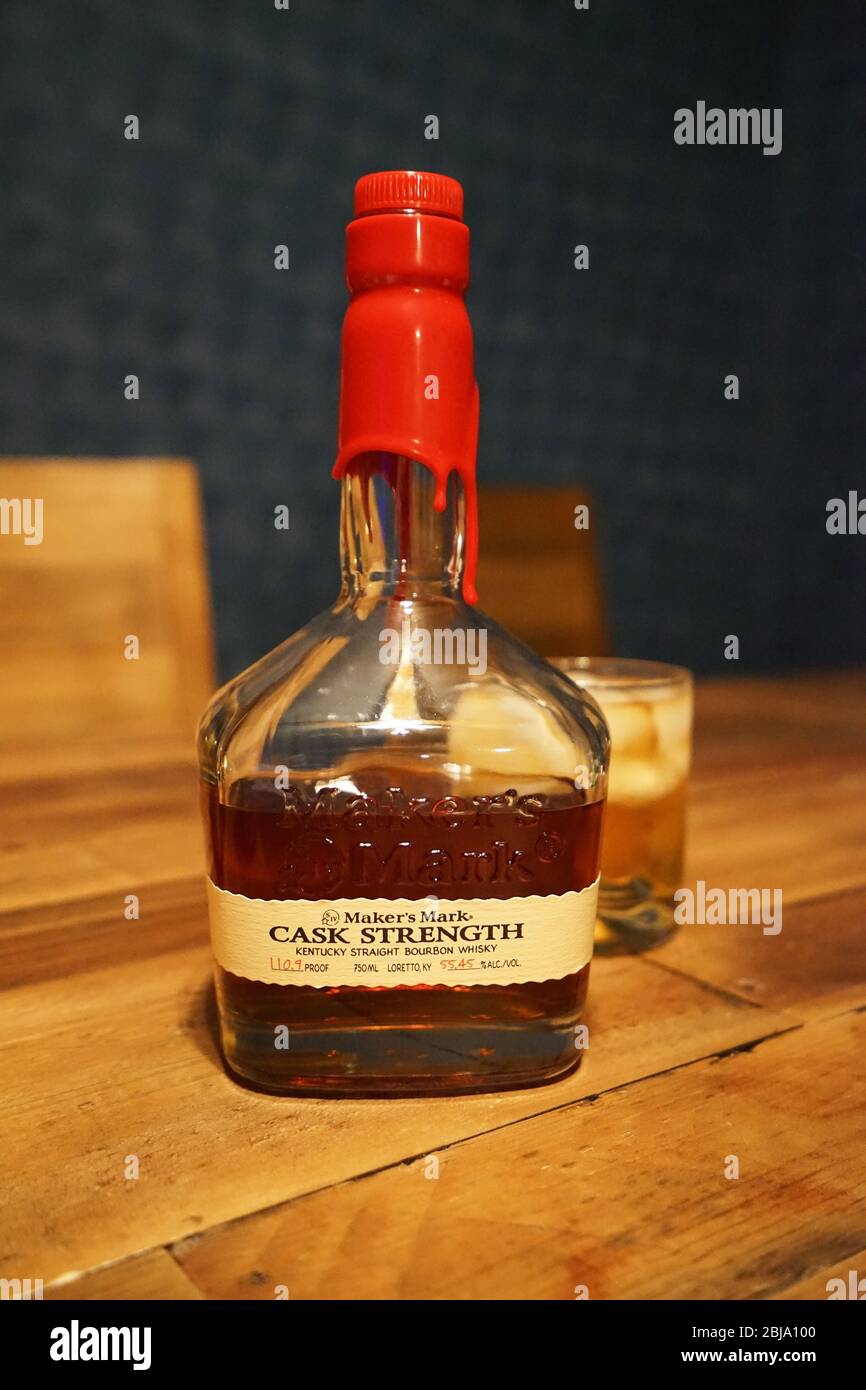 A bottle of 'MAKER'S MARK' bourbon whiskey on wooden table bar Stock Photo