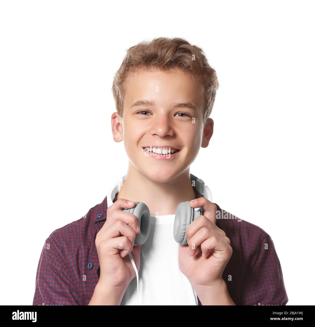 Boy listening music on light background Stock Photo - Alamy