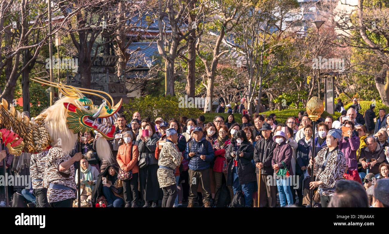tokyo, japan march 18 2020 Japanese puppet masters holding a golden