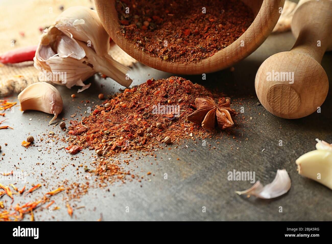 Different spices on gray background Stock Photo