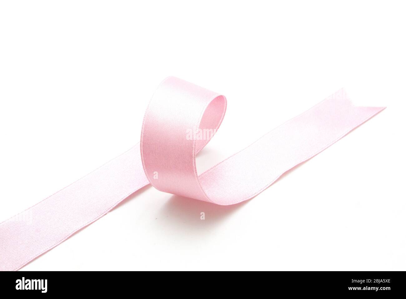Pink ribbon bow in isolated on white background Stock Photo - Alamy