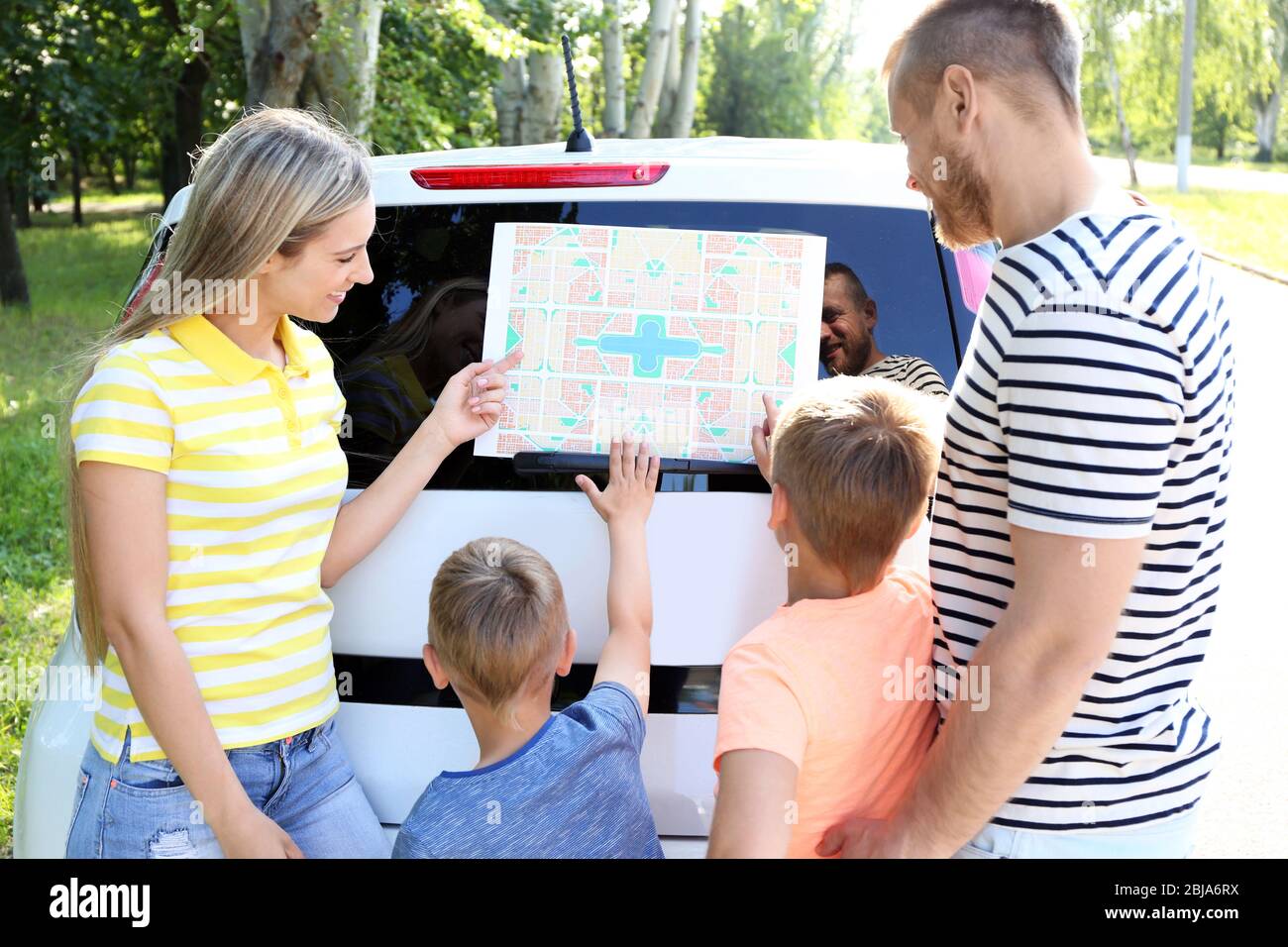 Family looking for road on map Stock Photo