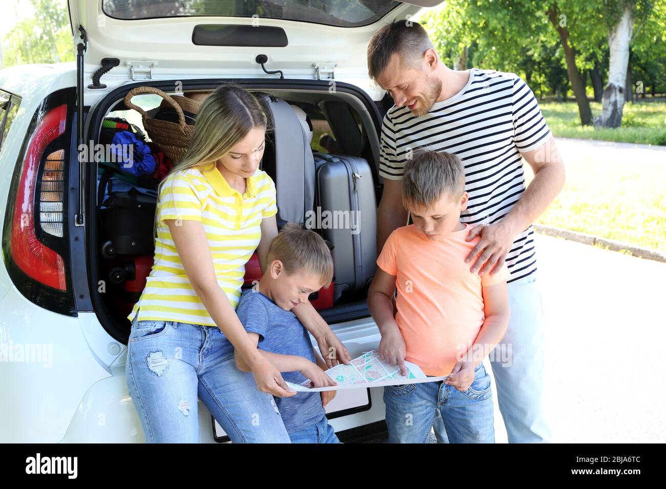 Family looking for road on map Stock Photo