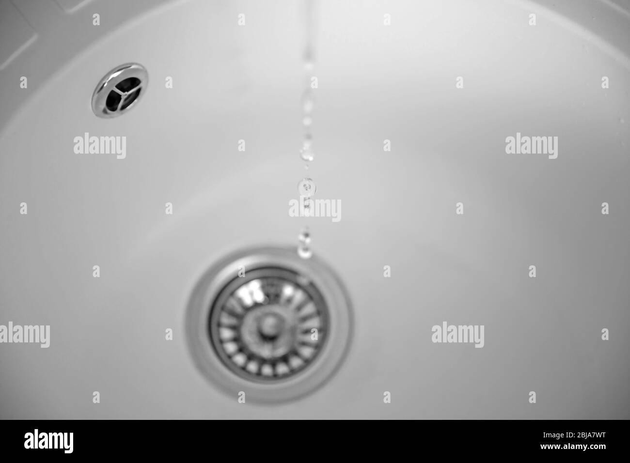 Water flowing into drain of kitchen sink Stock Photo Alamy