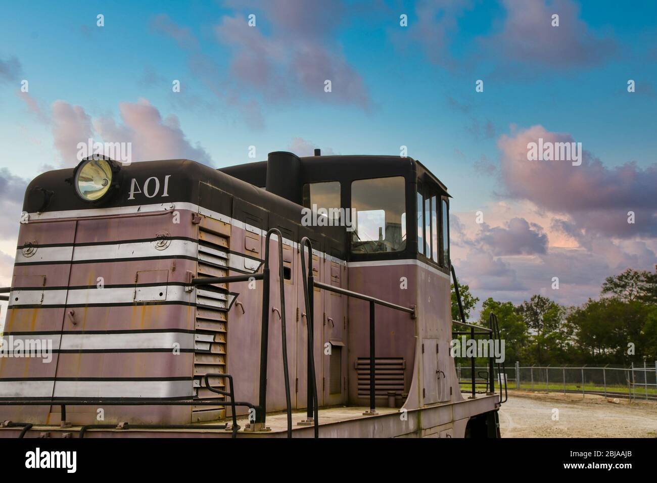 Old Train Engine in Field Stock Photo