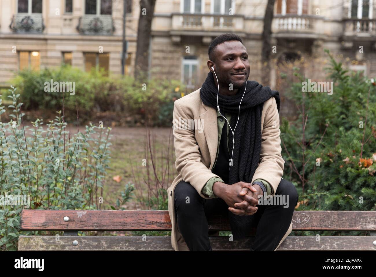 Handsome Black Man Sitting on Public Park Bench Backrest Stock Photo ...