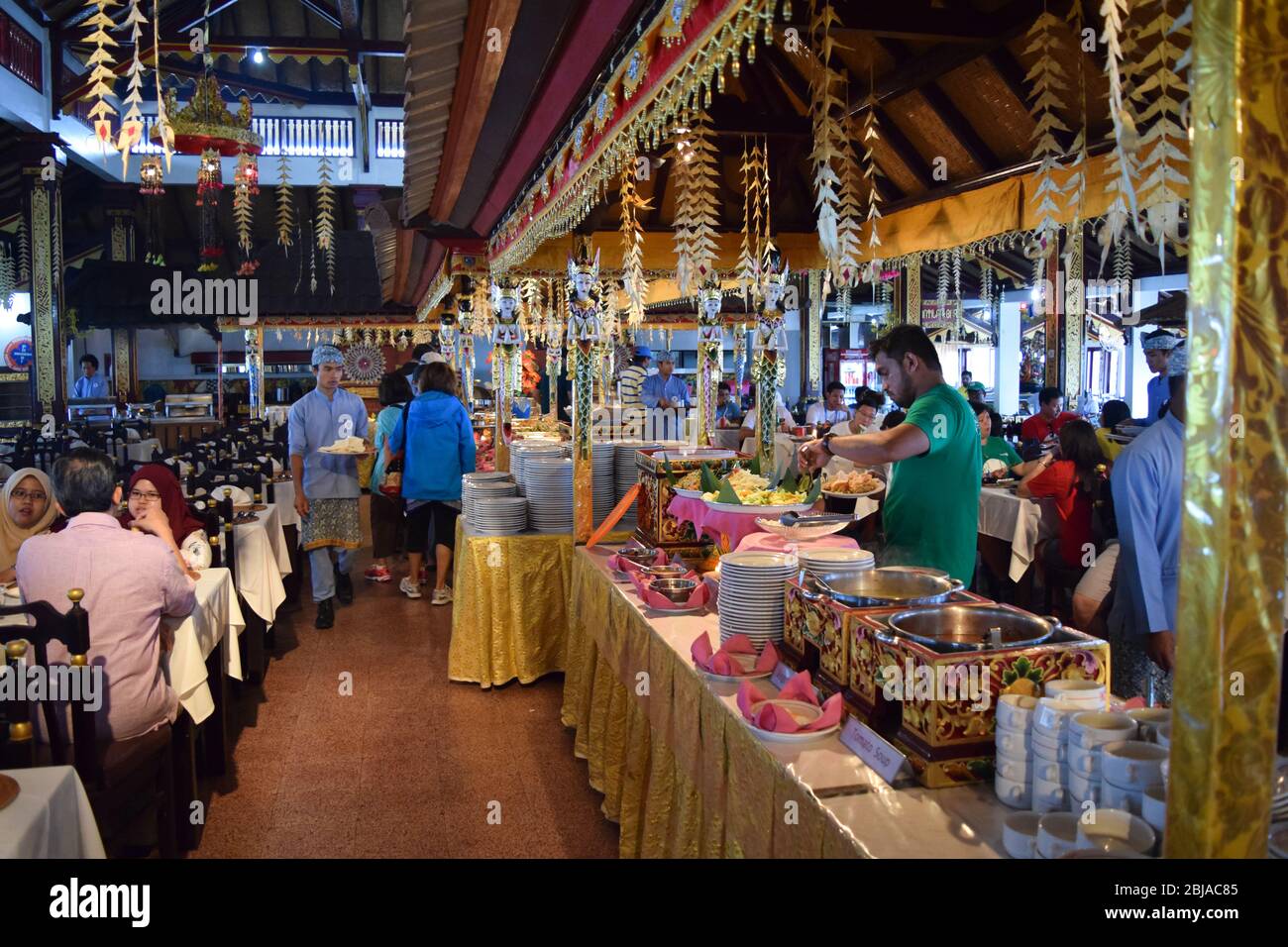 group of people eating at an Indonesian restaurant Stock Photo - Alamy