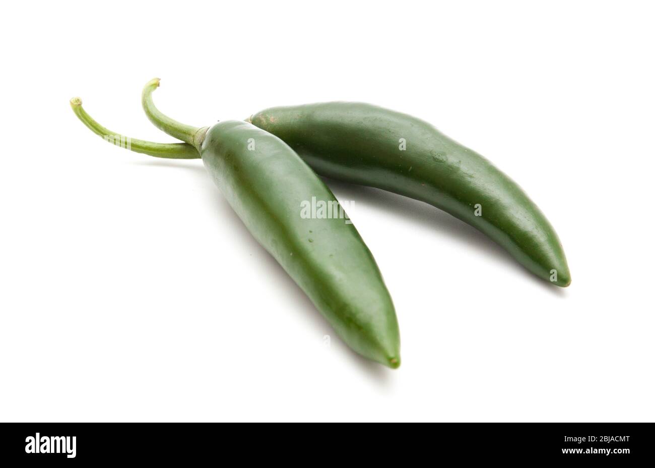 Red and green hot chili peppers isolated on white background closeup ...