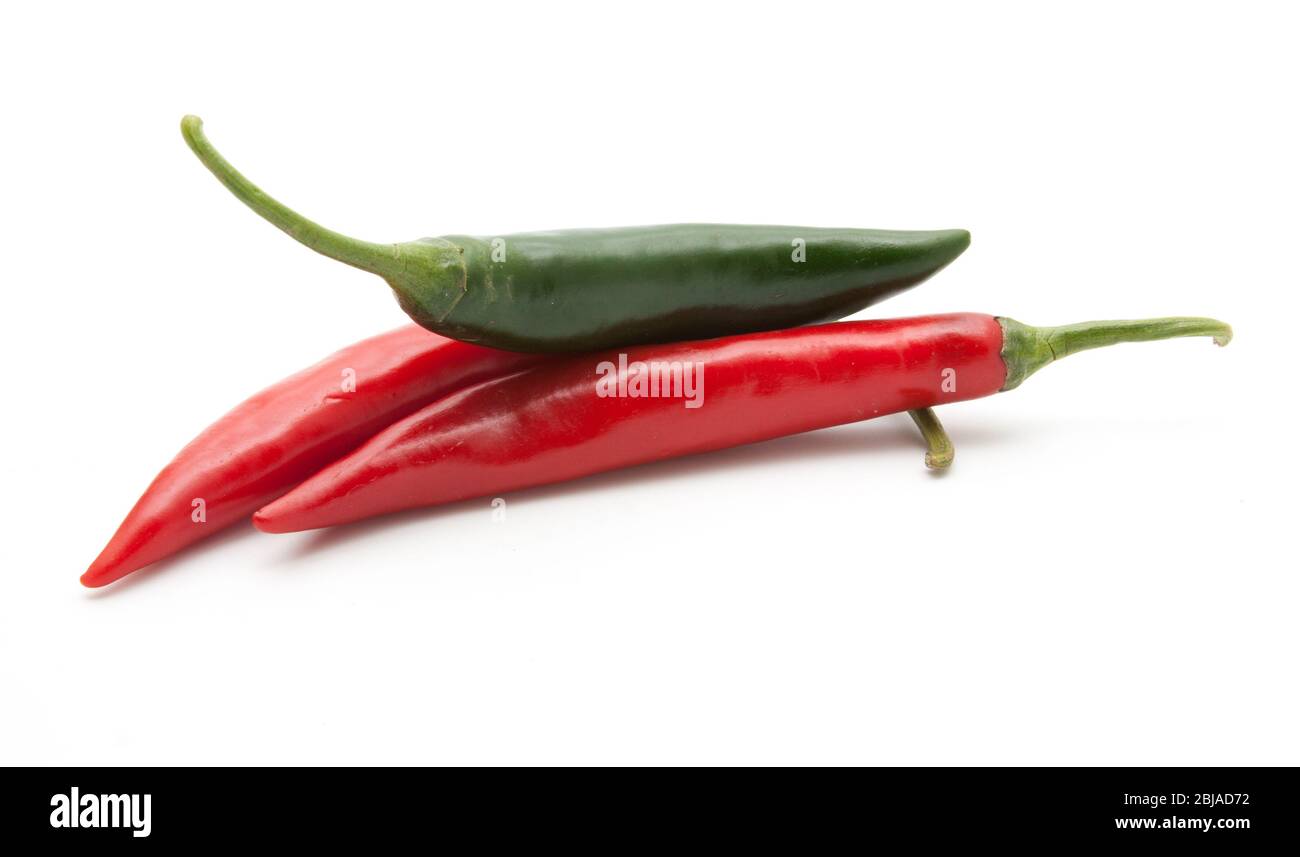 Red and green hot chili peppers isolated on white background closeup ...