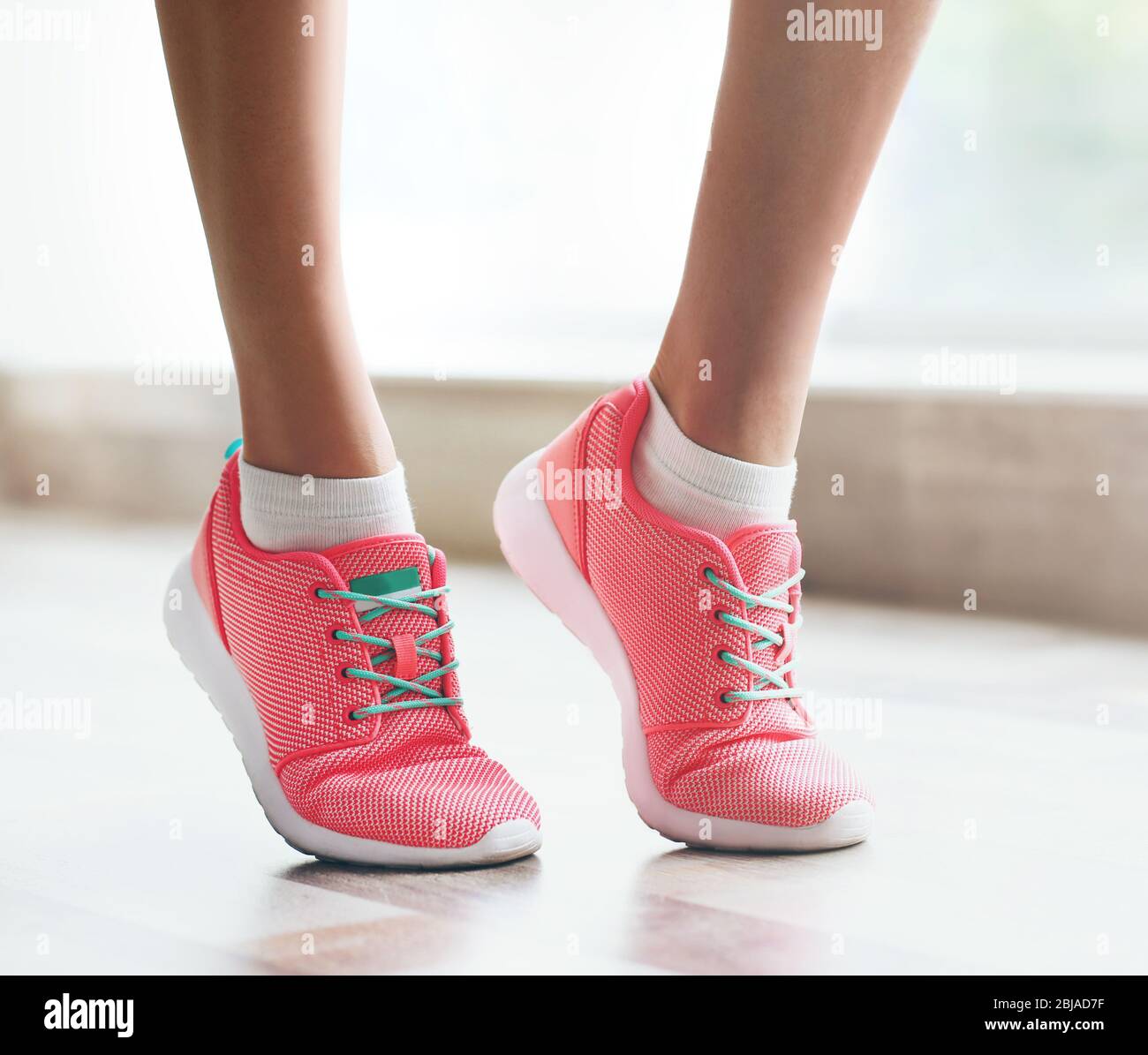 Woman wearing pink sneakers hi-res stock photography and images - Alamy