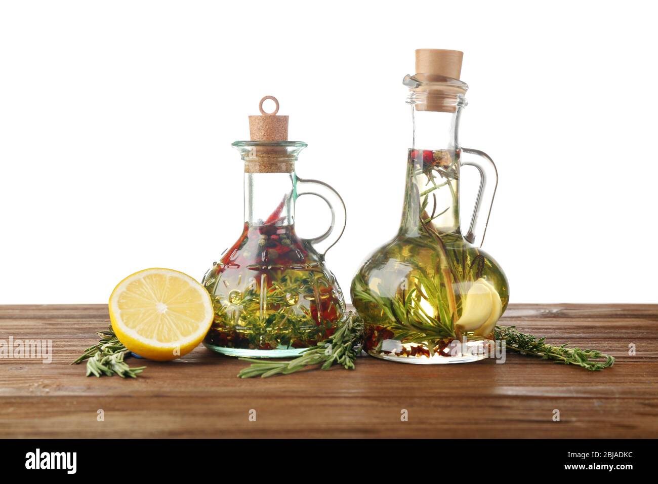 Olive oil with spices, isolated on white Stock Photo Alamy