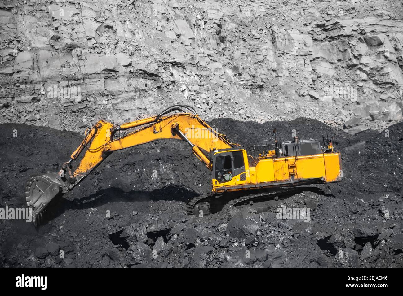 Open pit mine industry work of large yellow excavator for loading and coal  mining Stock Photo - Alamy