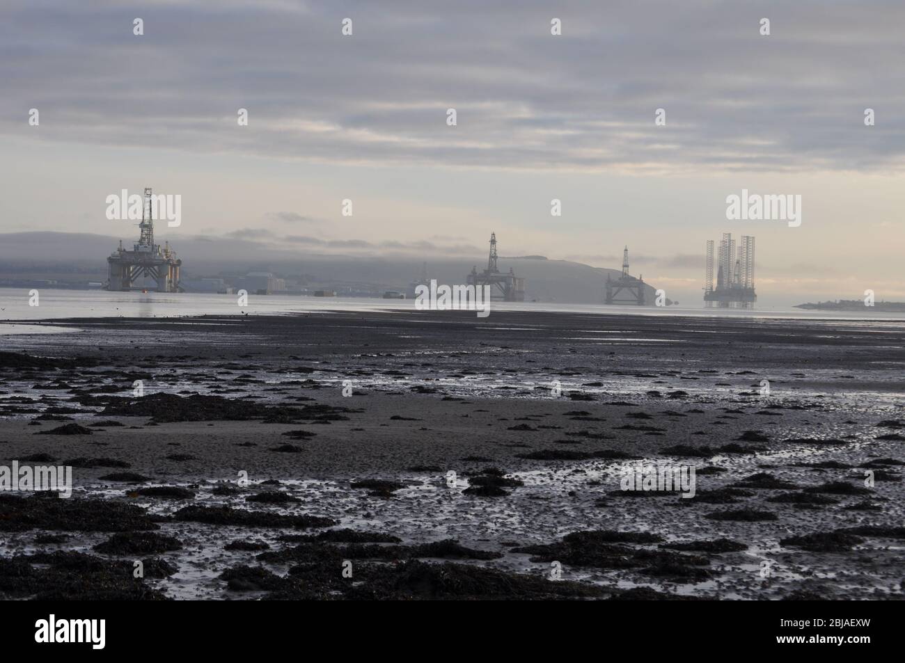 Oil Rigs in the Cromarty Firth, Scotland viewed from Balblair Stock Photo