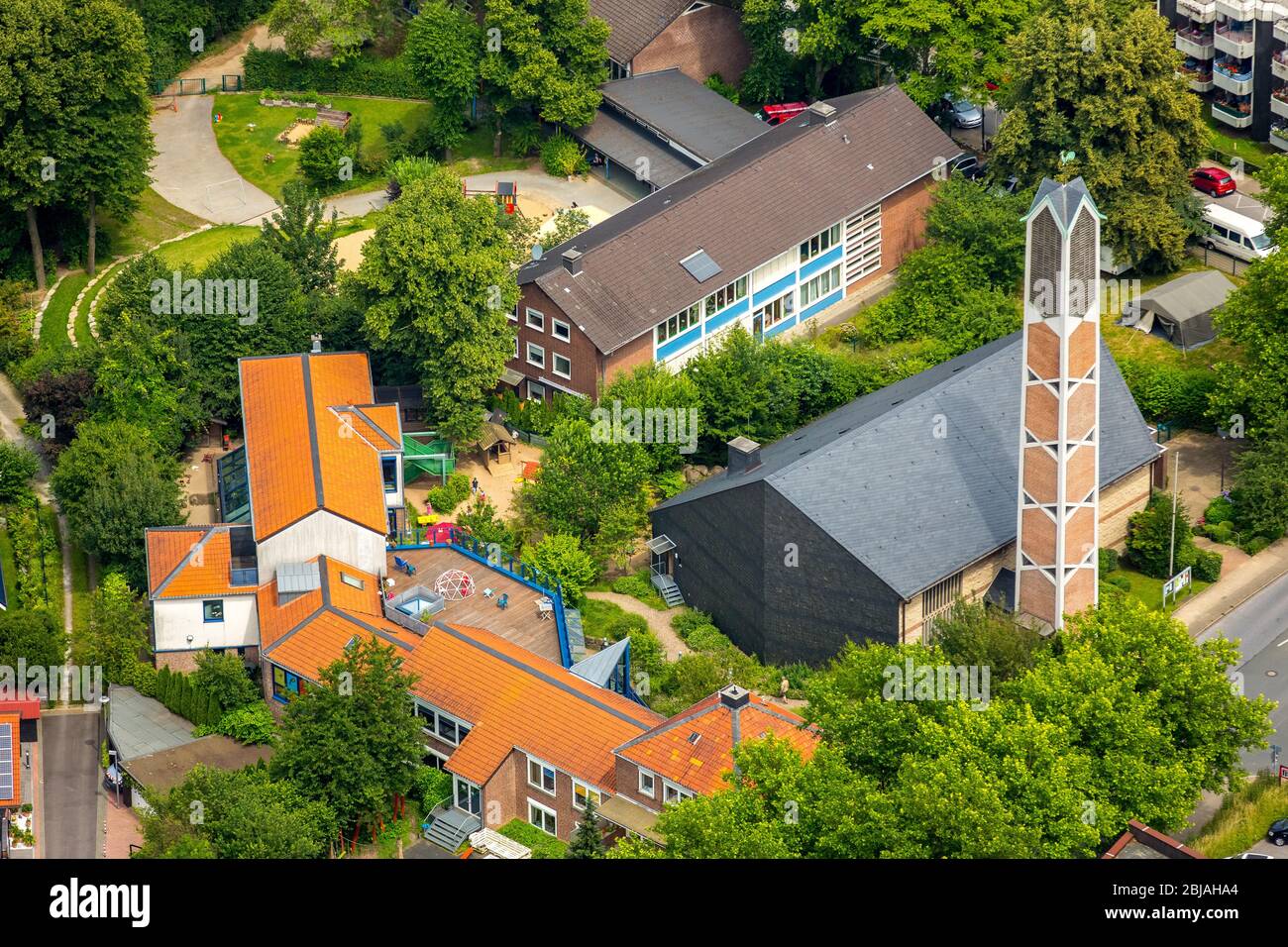 Daycare-Nursery Steppkeshaus in Heiligenhaus, in the foreground the Catholic Rectory St. Ludger, 07.07.2016, aerial view, Germany, North Rhine-Westphalia, Heiligenhaus Stock Photo
