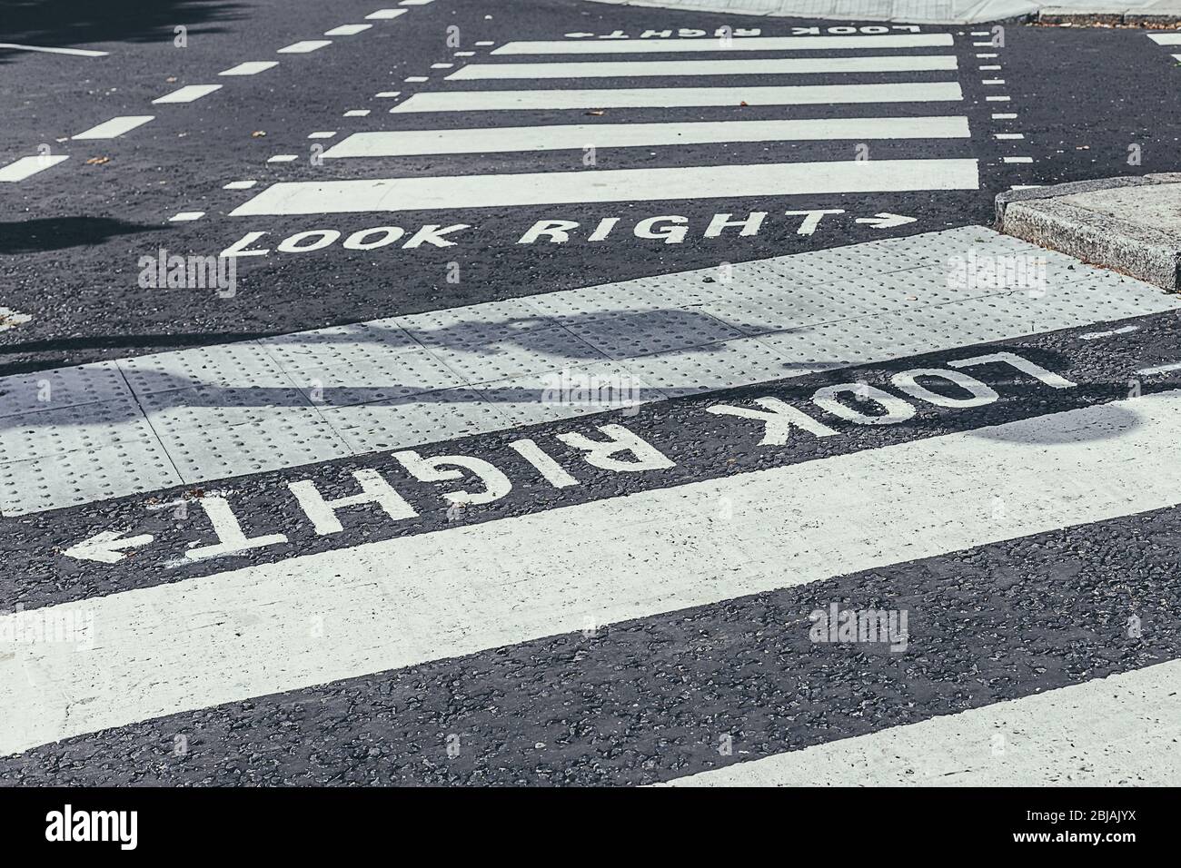 "Look right" road marking on a pedestrian crossing, reminding