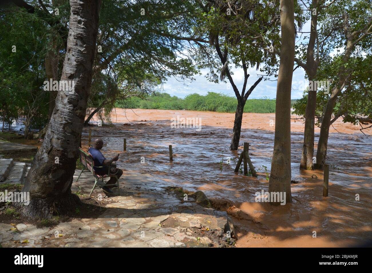 Ewasyiso Nyiro river flooding its banks at Sarova Shaba Game Lodge near Samburu and Buffalo Springs, Kenya East Africa Stock Photo