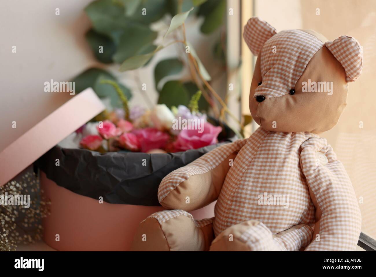 Box with fresh flowers and teddy bear on the windowsill Stock Photo - Alamy