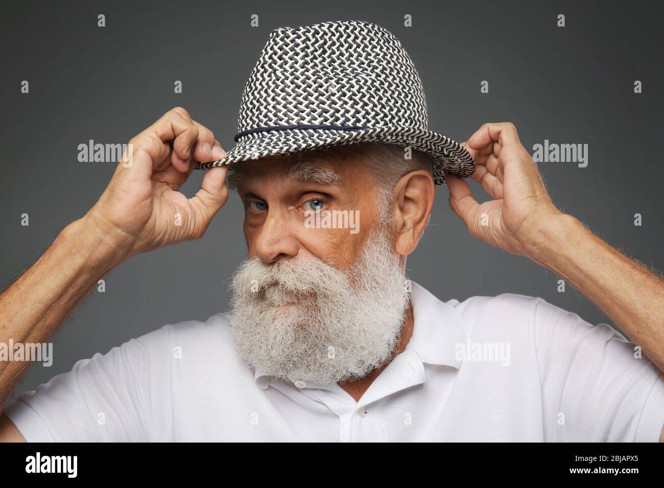 Older man white shirt hat hi-res stock photography and images - Alamy