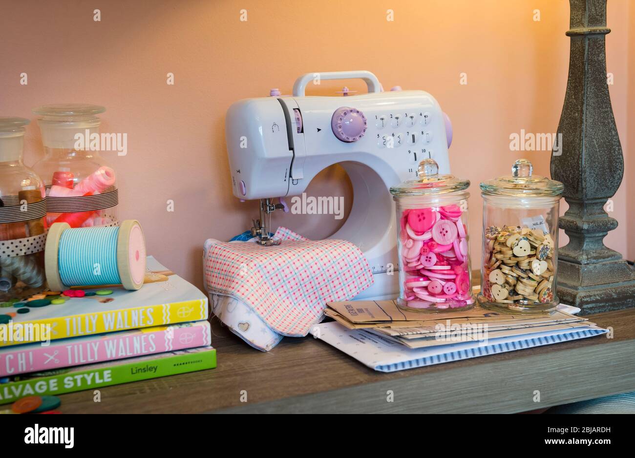 Sewing machine and materials in a study Stock Photo Alamy
