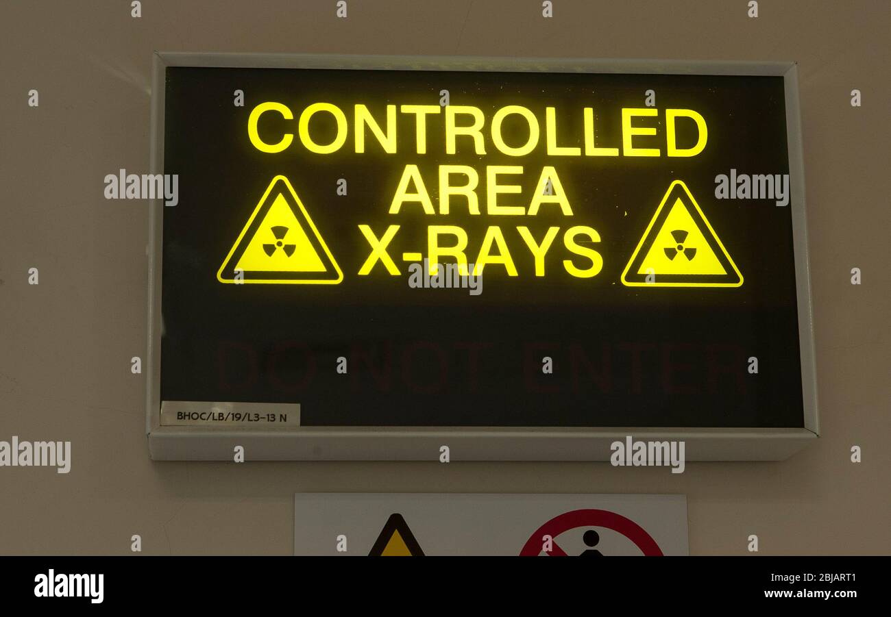 Sign outside an X-Ray room in a hospital in the UK. Stock Photo