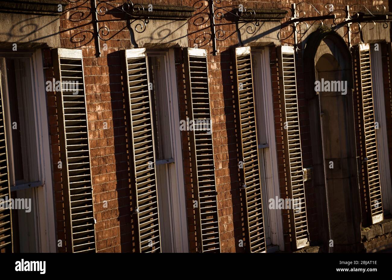 Wooden window shutters on a building. Stock Photo