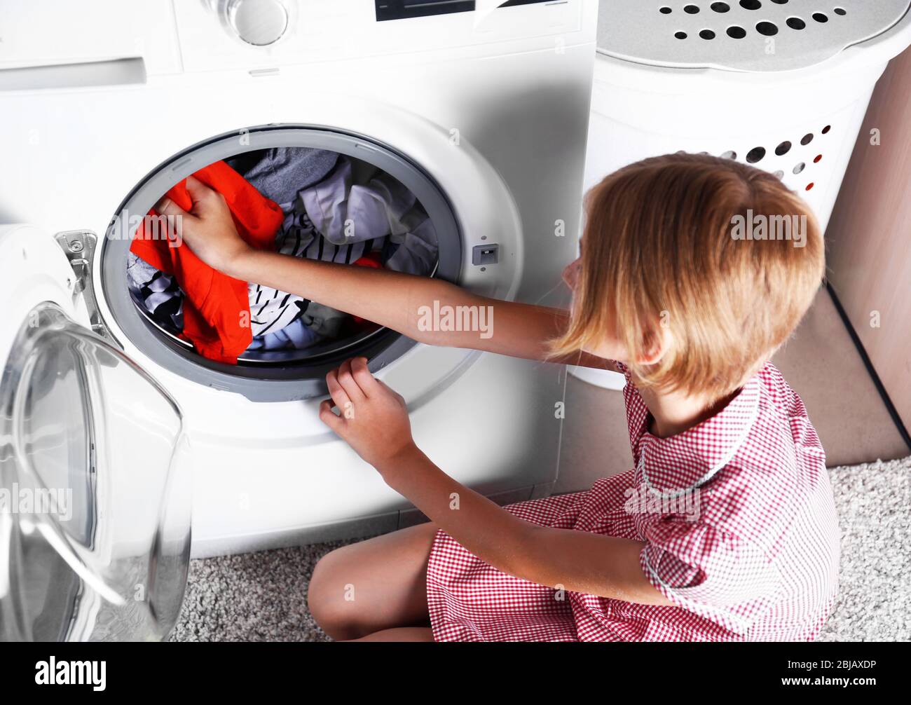 Girl washing clothes hires stock photography and images Alamy