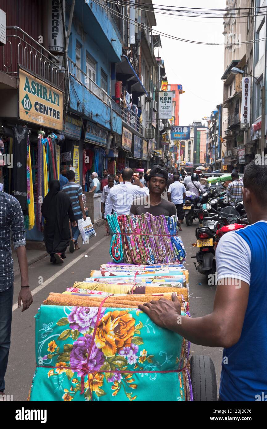 dh  COLOMBO SRI LANKA Delivering cloth material to Fabric shops in street people Stock Photo