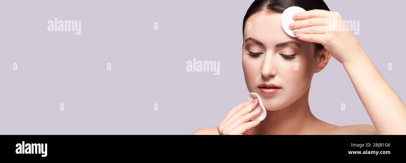 Girl remove mascara. Cotton pad. Skin care evening routine Stock Photo