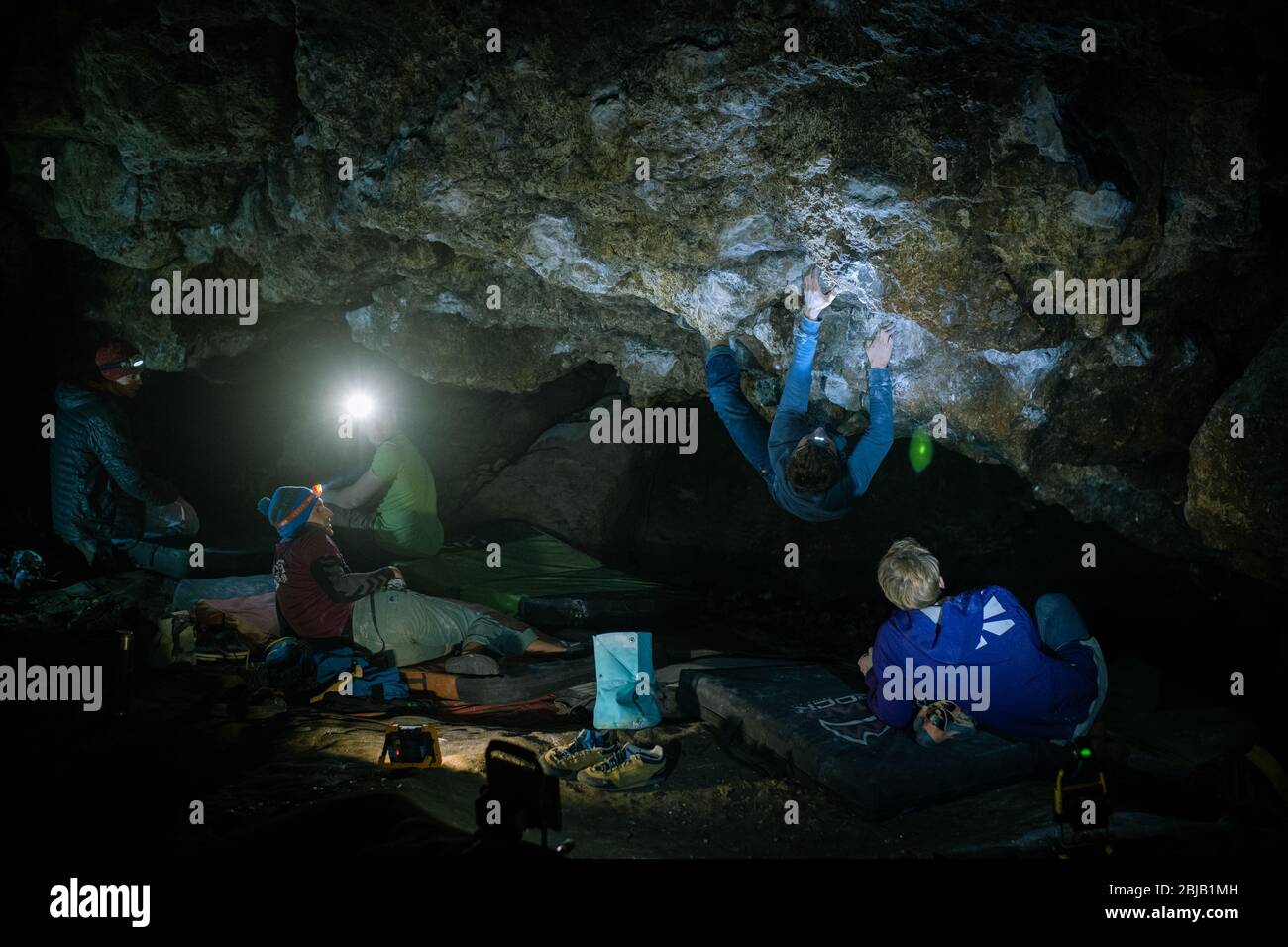Man is making a boulder in Twardowski cave. Bouldering in rock. Twardowski Cave Stock Photo