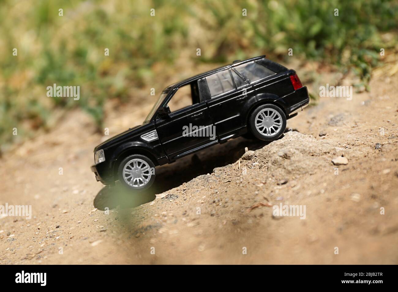 Close up of toy car on ground Stock Photo - Alamy