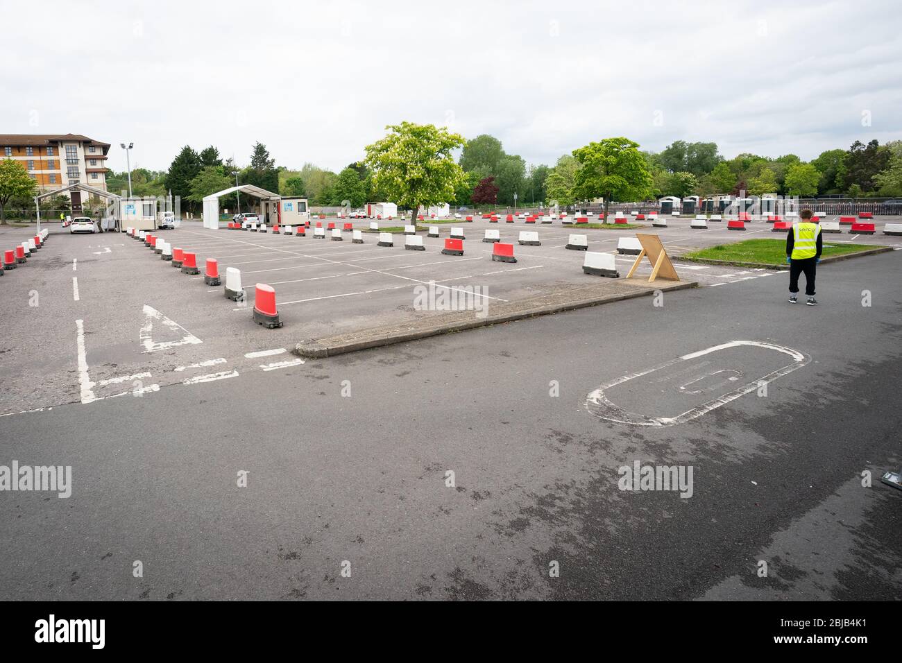 Near empty testing bays at a drive-in coronavirus testing facility at the Chessington World of Adventures Resort in south west London. Stock Photo