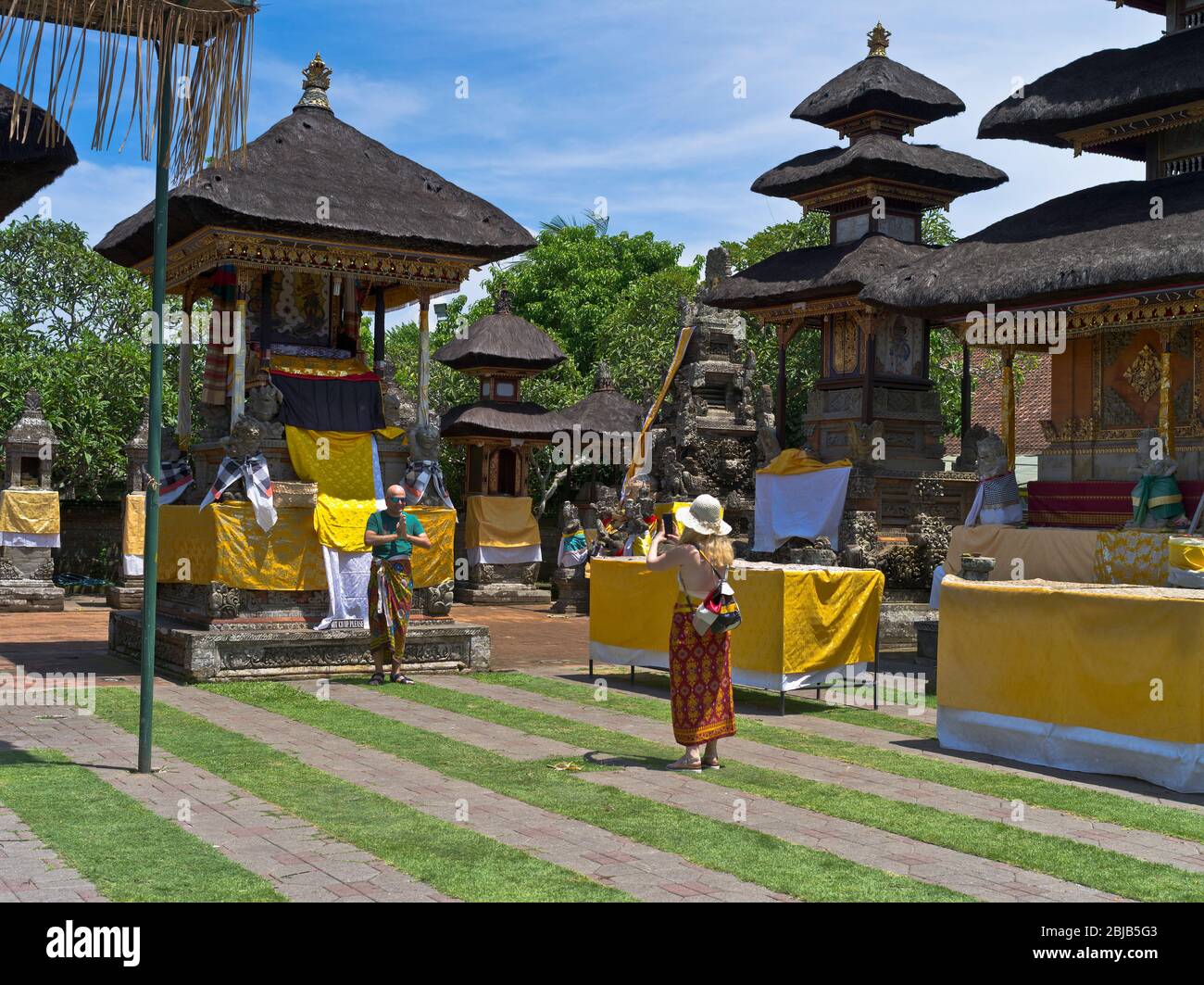 dh Balinese Batuan temple BALI INDONESIA Hindu temples tourists photo traditional dress code hinduism inner sanctum indonesian Stock Photo