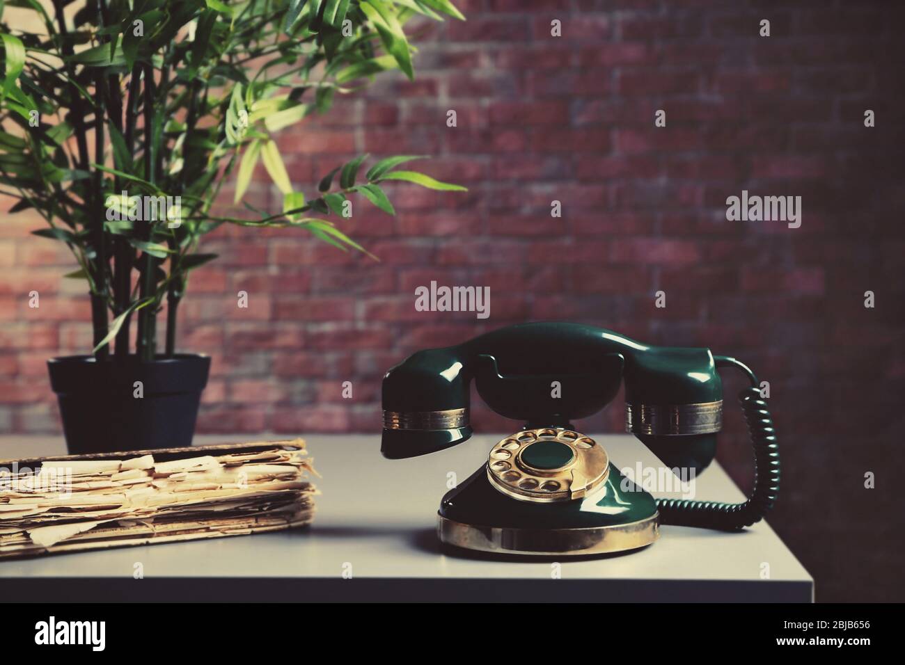 Old telephone on the table in room Stock Photo Alamy