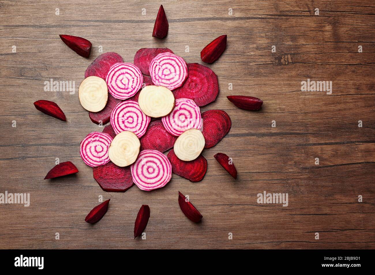 Sliced beetroot on wooden background, top view Stock Photo