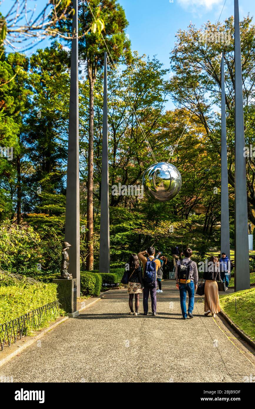 Hakone, Japan: November 02, 2019: Hakone Open Air Museum in Japan. People taking photos in reflective ball. Stock Photo
