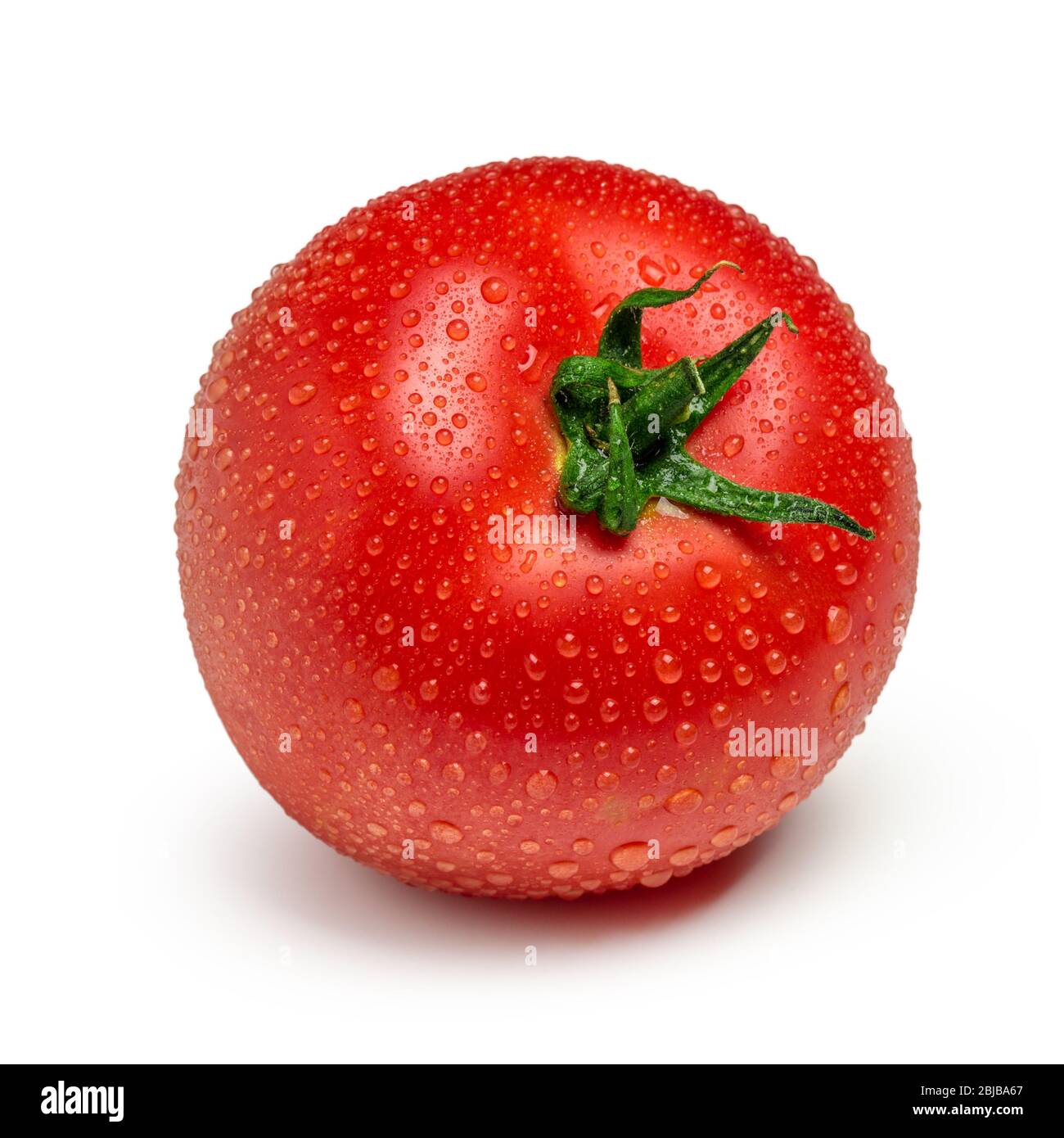 Tomato with drops isolated on white background Stock Photo - Alamy