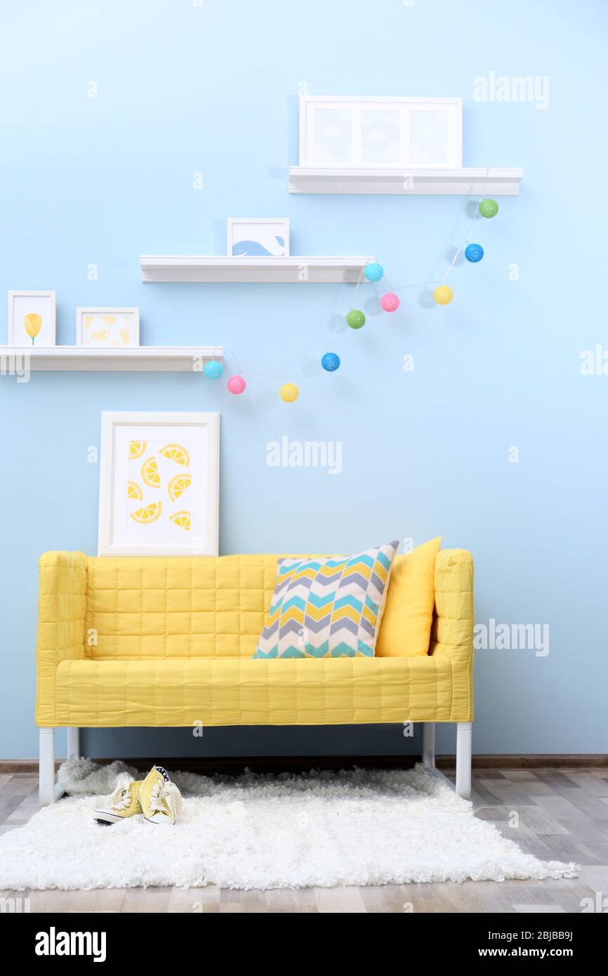 Modern living room interior design with yellow sofa Stock Photo - Alamy
