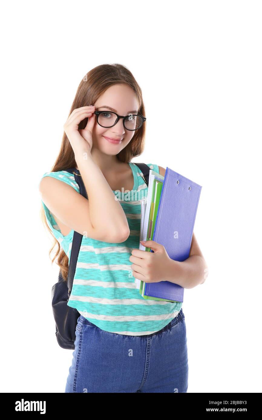 Cute teenage girl holding papers on white background Stock Photo - Alamy