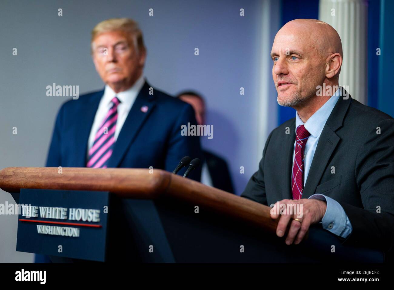 WASHINGTON DC, USA - 24 April 2020 - President Donald J. Trump listens as Dr. Stephen Hahn, Commissioner of the Food and Drug Administration, and a me Stock Photo